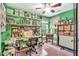 Organized craft room featuring shelving, storage, a desk, and a comfortable chair at 11 Bridgeport Dr, Durham, NC 27713