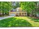 Charming two-story home with a well-manicured lawn, attached garage, and inviting front porch at 11 Bridgeport Dr, Durham, NC 27713