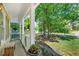 Welcoming front porch with white columns and a view of the landscaped front yard at 11 Bridgeport Dr, Durham, NC 27713