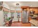 A spacious kitchen with wood cabinets, stainless steel appliances, granite countertops, and a breakfast nook at 11 Bridgeport Dr, Durham, NC 27713