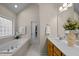 Bright bathroom with a large soaking tub and a vanity with lots of counter space at 11 Smoketree Ct, Durham, NC 27712