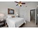 Cozy bedroom with a ceiling fan, a bed with a 