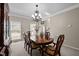 Formal dining room with traditional furnishings and natural light at 11 Smoketree Ct, Durham, NC 27712