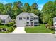 Charming two-story home with lush landscaping and a well-manicured lawn at 11 Smoketree Ct, Durham, NC 27712