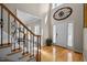 Elegant foyer with hardwood floors, high ceilings, and decorative wall art at 11 Smoketree Ct, Durham, NC 27712