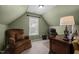Attic home office with neutral carpet, a comfortable armchair, and a classic executive wood desk and chair set at 11 Smoketree Ct, Durham, NC 27712