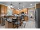 Stylish kitchen with stainless steel appliances, granite countertops, and tile flooring at 11 Smoketree Ct, Durham, NC 27712