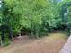 Mature trees provide privacy to a beautiful, spacious and well-maintained backyard at 1101 Washhouse Ln, Wake Forest, NC 27587