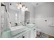 Stylish bathroom featuring double sinks, modern fixtures, and sleek countertops at 1101 Washhouse Ln, Wake Forest, NC 27587