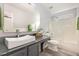 This is a modern bathroom that includes a large vanity and tub/shower combo at 1101 Washhouse Ln, Wake Forest, NC 27587