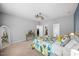 Comfortable bedroom featuring carpet, ceiling fan, and access to a walk-in closet and bathroom at 1101 Washhouse Ln, Wake Forest, NC 27587