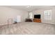This large bonus room features neutral paint, carpet and two windows at 1101 Washhouse Ln, Wake Forest, NC 27587