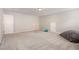 Large bonus room with neutral colors, grey carpet, and lots of room to add your own style at 1101 Washhouse Ln, Wake Forest, NC 27587