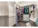 This walk-in closet features custom shelving, drawers, and ample storage space at 1101 Washhouse Ln, Wake Forest, NC 27587
