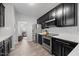 Elegant kitchen featuring stainless steel appliances, subway tile backsplash, and ample counter space at 1101 Washhouse Ln, Wake Forest, NC 27587