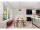 Bright eat-in kitchen featuring white countertops, stainless steel appliances, and ample natural light at 1101 Washhouse Ln, Wake Forest, NC 27587