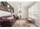 Cozy living room featuring stylish decor, comfortable seating, and abundant natural light at 1101 Washhouse Ln, Wake Forest, NC 27587