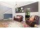 Cozy living room featuring stylish decor, comfortable seating, and direct access to the kitchen at 1101 Washhouse Ln, Wake Forest, NC 27587