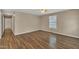 Spacious bedroom with hardwood floors, neutral walls, ceiling fan, and a bright window at 1112 Mark St, Raleigh, NC 27601