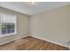 Bright bedroom featuring a window and wood-look flooring at 1112 Mark St, Raleigh, NC 27601