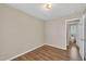 Bedroom featuring wood-look floors and an ensuite bathroom at 1112 Mark St, Raleigh, NC 27601