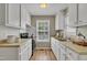 Galley kitchen with stainless steel appliances and ample counter space at 1112 Mark St, Raleigh, NC 27601