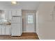The kitchen shows the refrigerator, back door, and extra cabinet space at 1112 Mark St, Raleigh, NC 27601