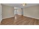 Inviting living room featuring hardwood floors, neutral walls, and a ceiling fan with light fixture at 1112 Mark St, Raleigh, NC 27601
