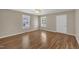 Bright living room featuring hardwood flooring and neutral paint throughout at 1112 Mark St, Raleigh, NC 27601