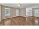 Open-concept living space flows into the kitchen, with hardwood floors and neutral paint throughout at 1112 Mark St, Raleigh, NC 27601