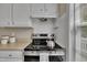 Modern stainless steel oven with white cabinets and countertops nearby at 1112 Mark St, Raleigh, NC 27601