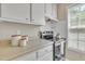 Stainless steel stove and oven area with plenty of storage cabinets at 1112 Mark St, Raleigh, NC 27601