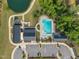 Community amenities include a swimming pool, clubhouse, and parking area, with a nearby pond at 112 Serenata Dr, Holly Springs, NC 27540