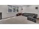 Spacious basement rec room with a couch and a mounted projector at 112 Serenata Dr, Holly Springs, NC 27540