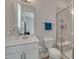Modern bathroom with a marble countertop vanity and glass-enclosed shower at 112 Serenata Dr, Holly Springs, NC 27540