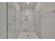 Modern bathroom with a glass enclosed shower, a built-in bench, and tile surround at 112 Serenata Dr, Holly Springs, NC 27540