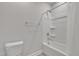 Clean bathroom with a toilet, a shower, and a white shower curtain at 112 Serenata Dr, Holly Springs, NC 27540