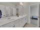 Elegant bathroom featuring a double vanity, ample counter space, and natural light, creating a luxurious retreat at 112 Serenata Dr, Holly Springs, NC 27540