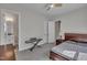 Comfortable bedroom featuring carpet floors, natural light, and a view of the en-suite bathroom at 112 Serenata Dr, Holly Springs, NC 27540