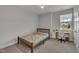 Cozy bedroom featuring a window desk area that offers a nice view of the outdoors at 112 Serenata Dr, Holly Springs, NC 27540