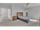 Spacious bedroom featuring a comfortable bed, ceiling fan, and neutral tones, perfect for relaxation and rest at 112 Serenata Dr, Holly Springs, NC 27540