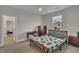 Comfortable bedroom featuring a ceiling fan, a window and a matching dresser at 112 Serenata Dr, Holly Springs, NC 27540