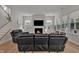 Inviting living room features a fireplace, recessed lighting, and modern decor for a comfortable living space at 112 Serenata Dr, Holly Springs, NC 27540