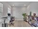 Bright office space with hardwood floors, a large window, and contemporary furnishings at 112 Serenata Dr, Holly Springs, NC 27540