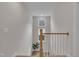 Bright hallway with a staircase, neutral paint, and modern finishes at 112 Serenata Dr, Holly Springs, NC 27540