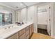 Bathroom featuring a double vanity, carpeted floor, and tiled shower/tub combo at 11470 Club Dr, Chapel Hill, NC 27517