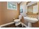 Traditional half bathroom featuring pedestal sink and framed mirror at 11470 Club Dr, Chapel Hill, NC 27517