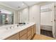 Elegant bathroom with a double vanity, large mirror, and access to a separate shower and toilet area at 11470 Club Dr, Chapel Hill, NC 27517