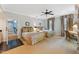Spacious bedroom featuring two queen beds and a ceiling fan at 11470 Club Dr, Chapel Hill, NC 27517