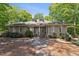Charming one-story home with stone pathway, dormer windows, and lush landscaping at 11470 Club Dr, Chapel Hill, NC 27517